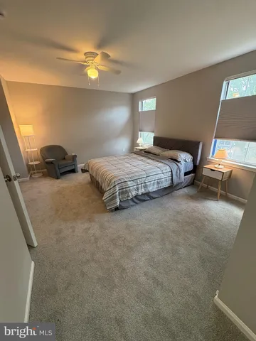 a bedroom with bed and a window