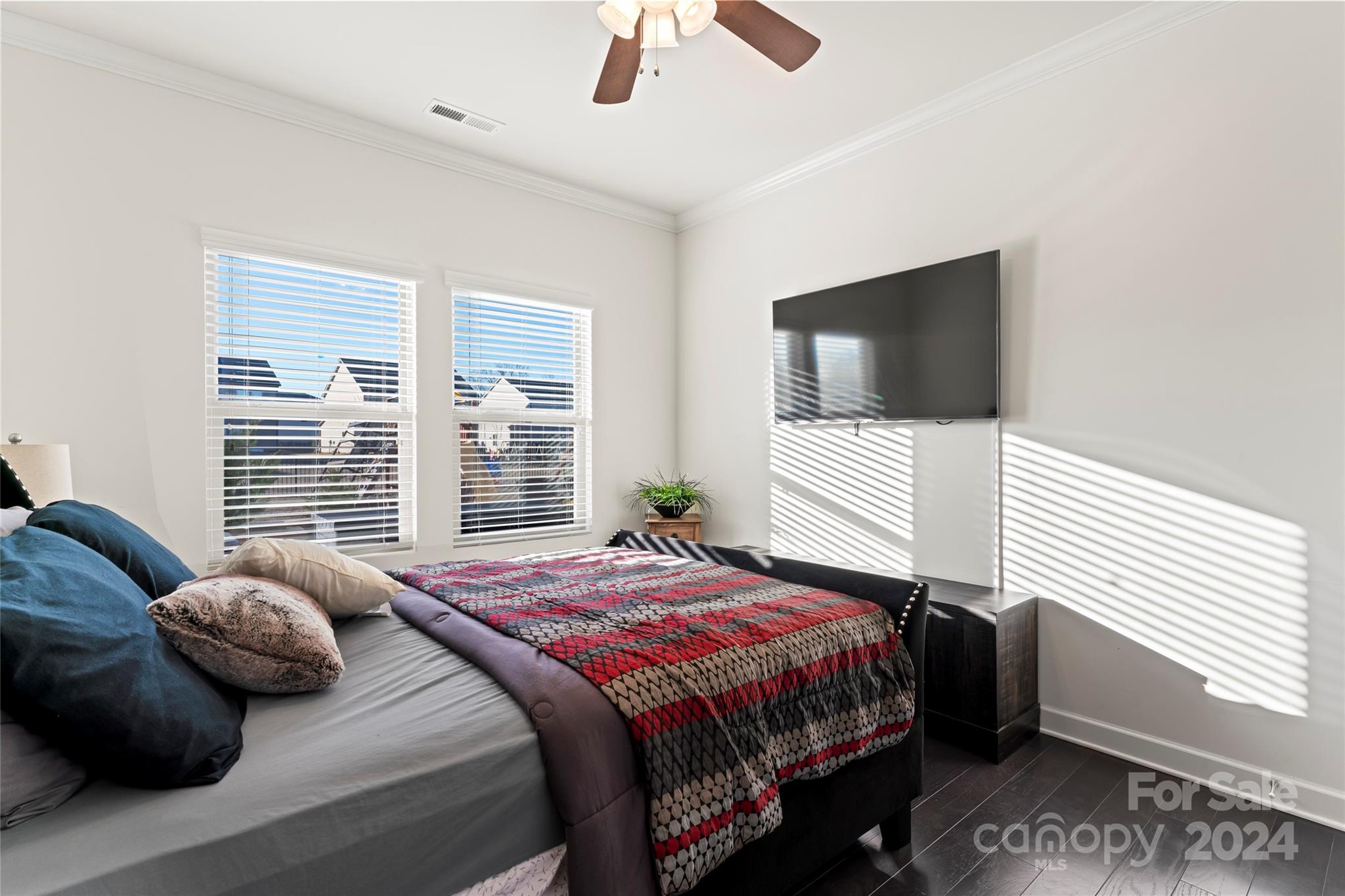 7227 Rupell Drive Charlotte, NC 28273 - Photo 16 of 45 a bedroom with a bed and a flat screen tv