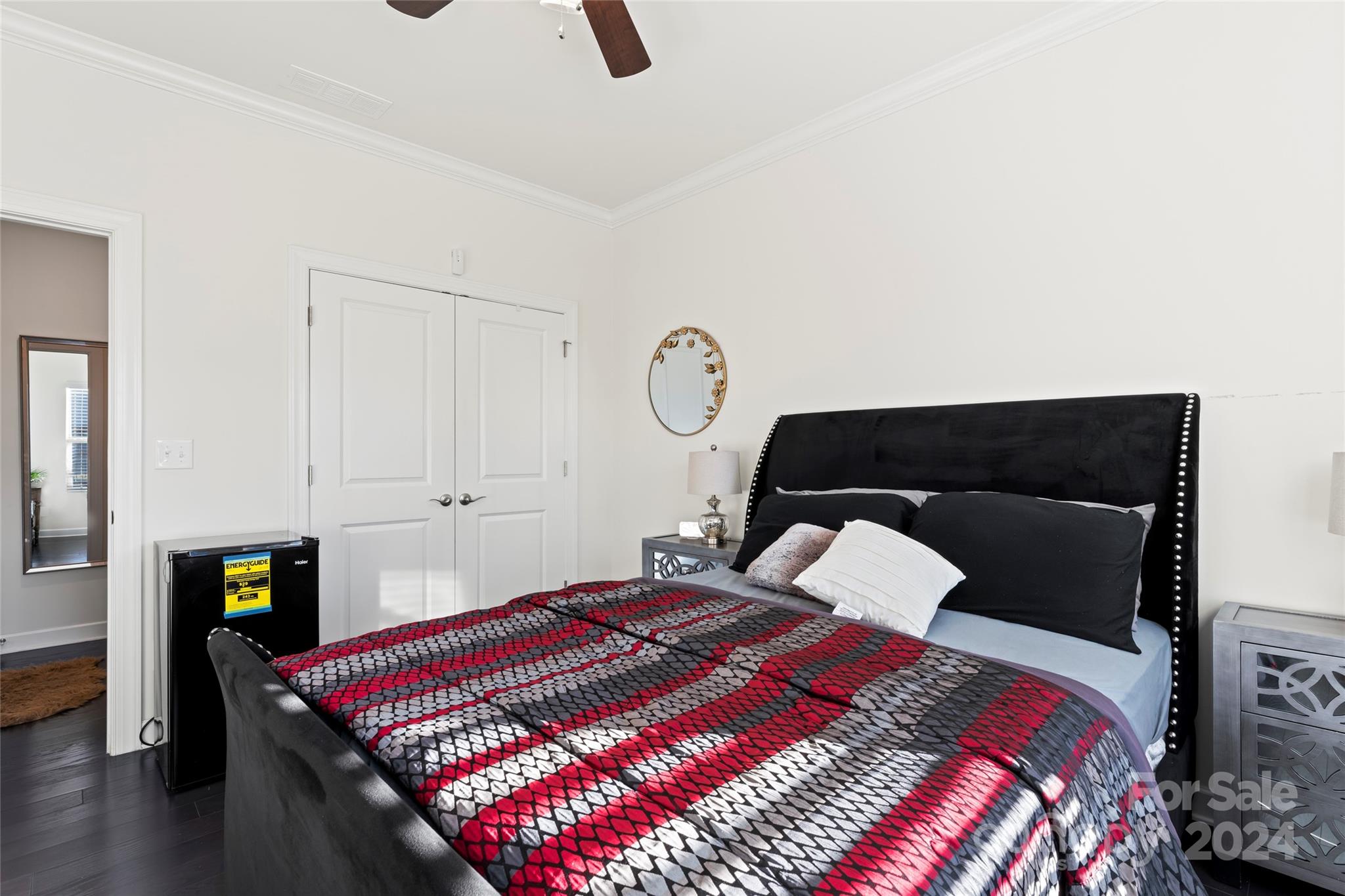 7227 Rupell Drive Charlotte, NC 28273 - Photo 18 of 45 a bedroom with a bed and a lamp on dresser