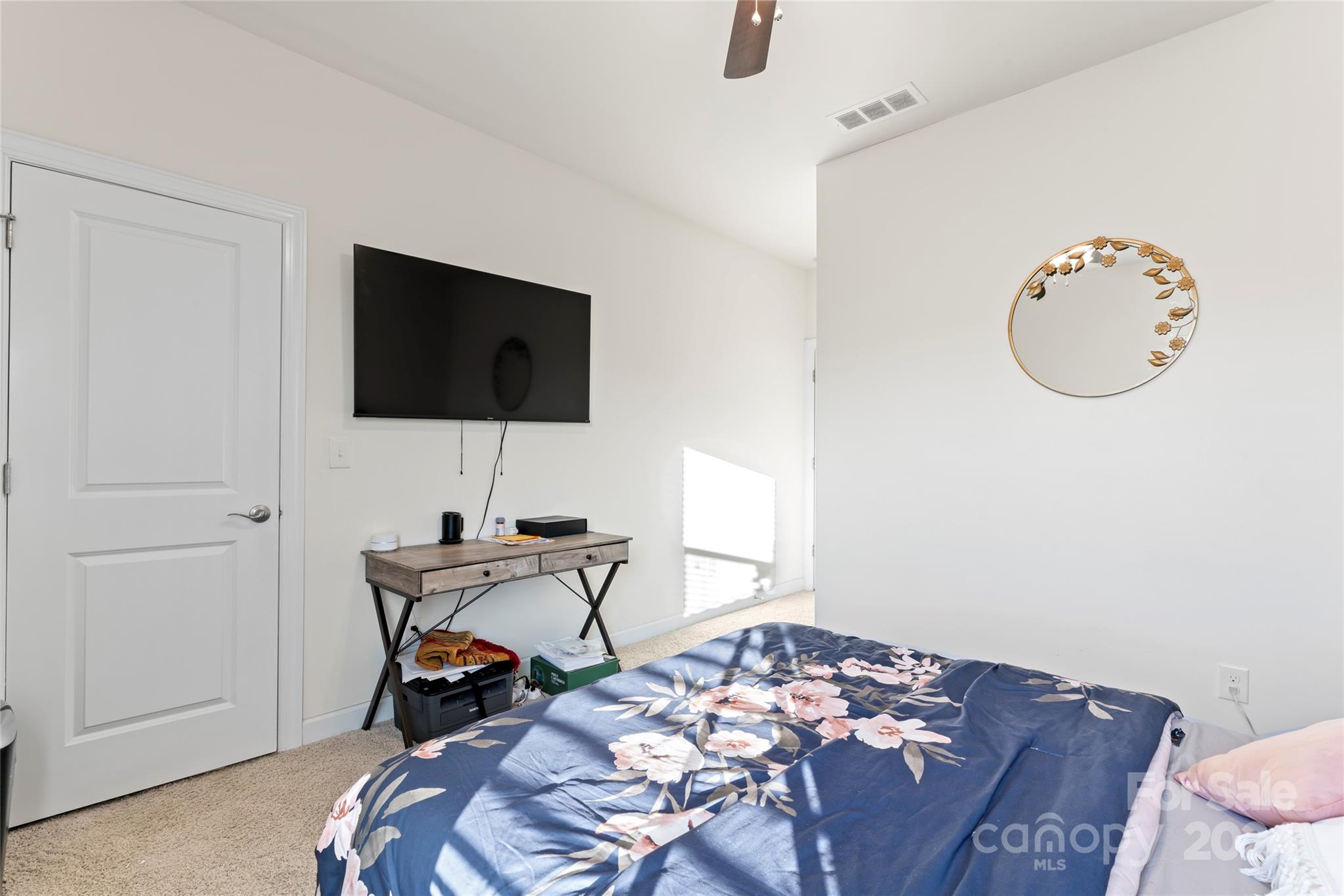 7227 Rupell Drive Charlotte, NC 28273 - Photo 33 of 45 a bedroom with a bed and a flat screen tv