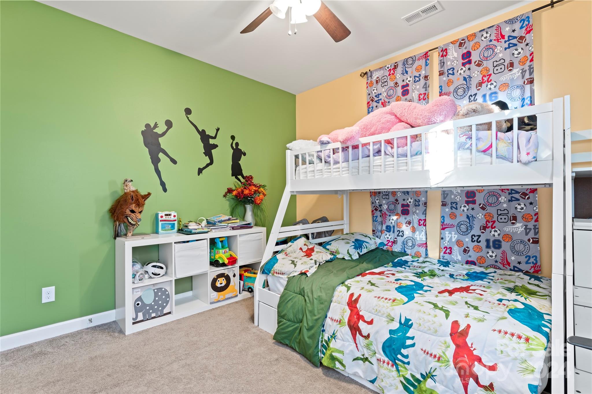 7227 Rupell Drive Charlotte, NC 28273 - Photo 37 of 45 a bedroom with a bed and a bookshelf