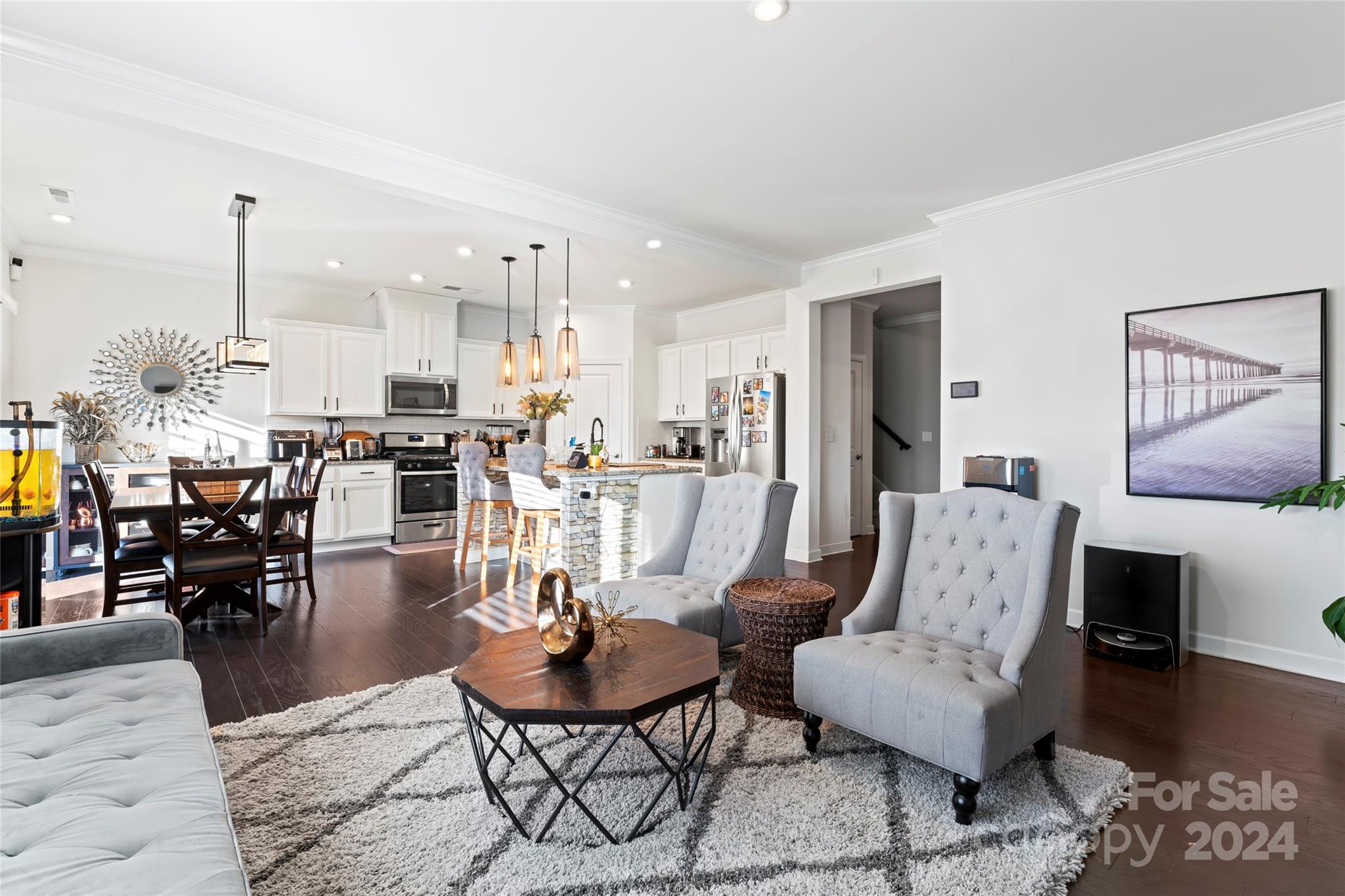 7227 Rupell Drive Charlotte, NC 28273 - Photo 6 of 45 a living room with couches and kitchen view with wooden floor