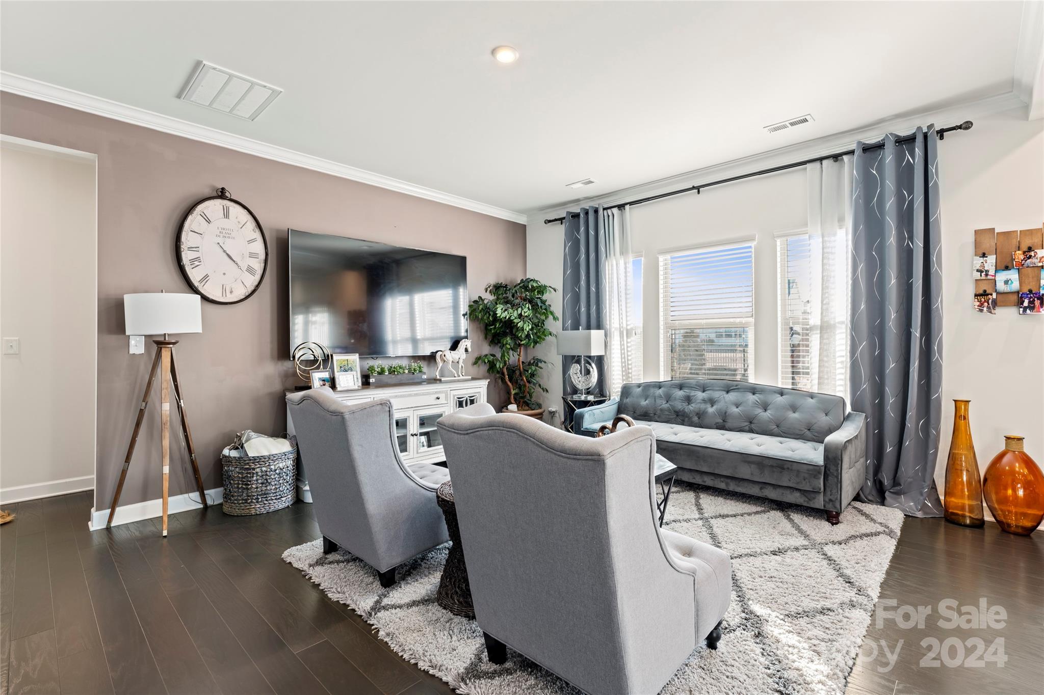 7227 Rupell Drive Charlotte, NC 28273 - Photo 7 of 45 a living room with furniture a wooden floor and a large window