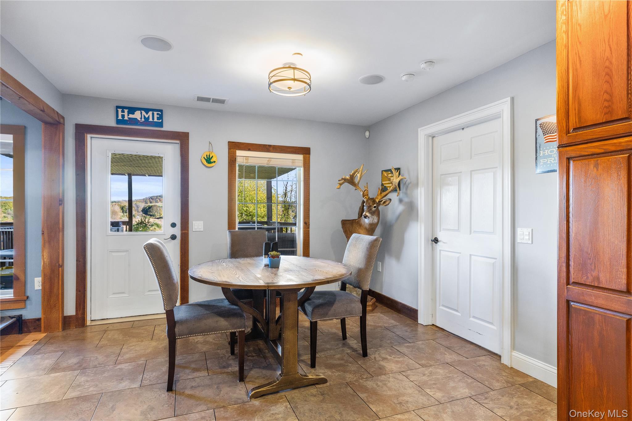 80 Rudd Pond Road Millerton, NY 12546 - Photo 14 of 22 a view of a dining room with furniture and a window