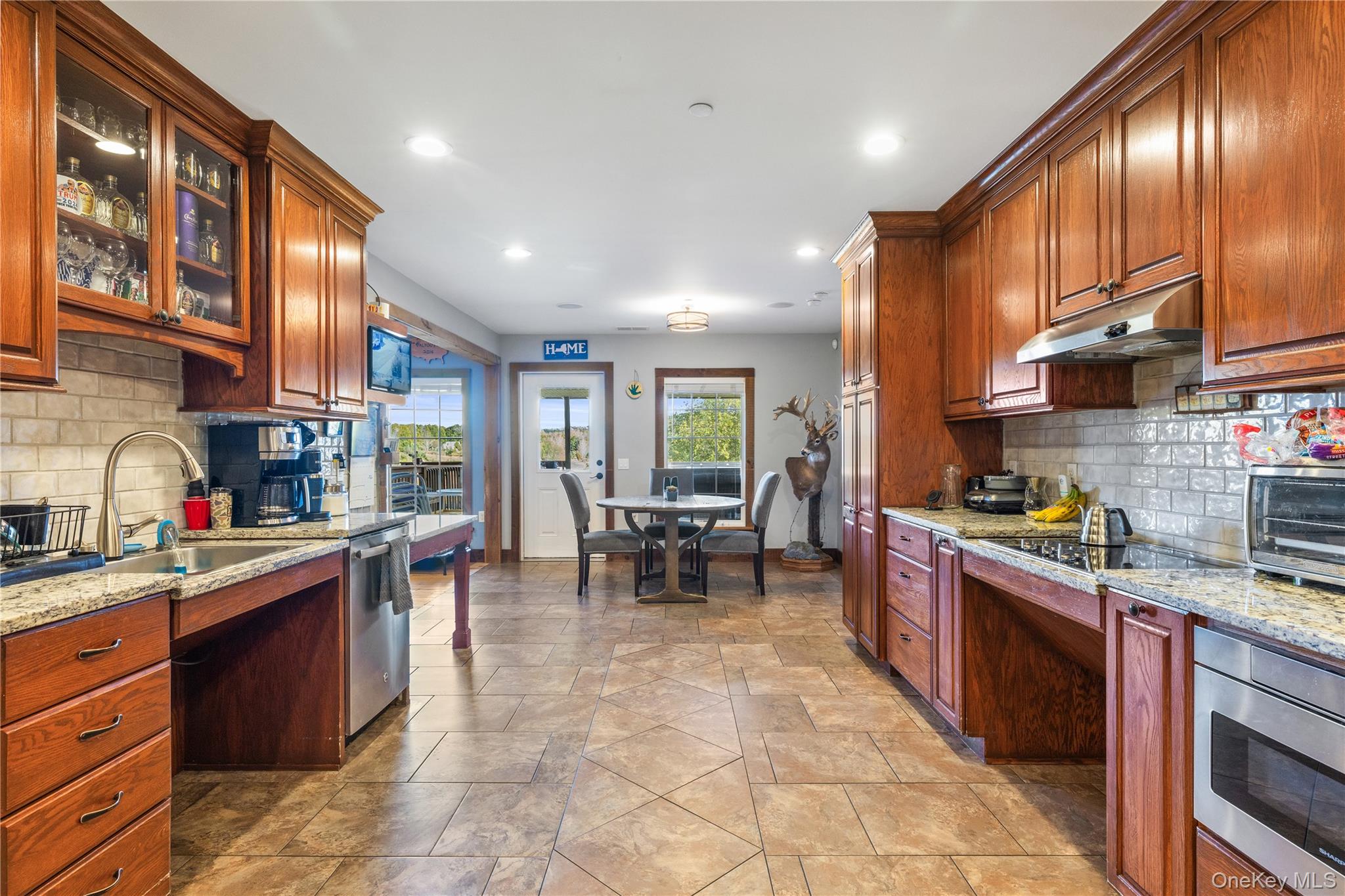 80 Rudd Pond Road Millerton, NY 12546 - Photo 15 of 22 a kitchen with stainless steel appliances granite countertop sink stove top oven and cabinets