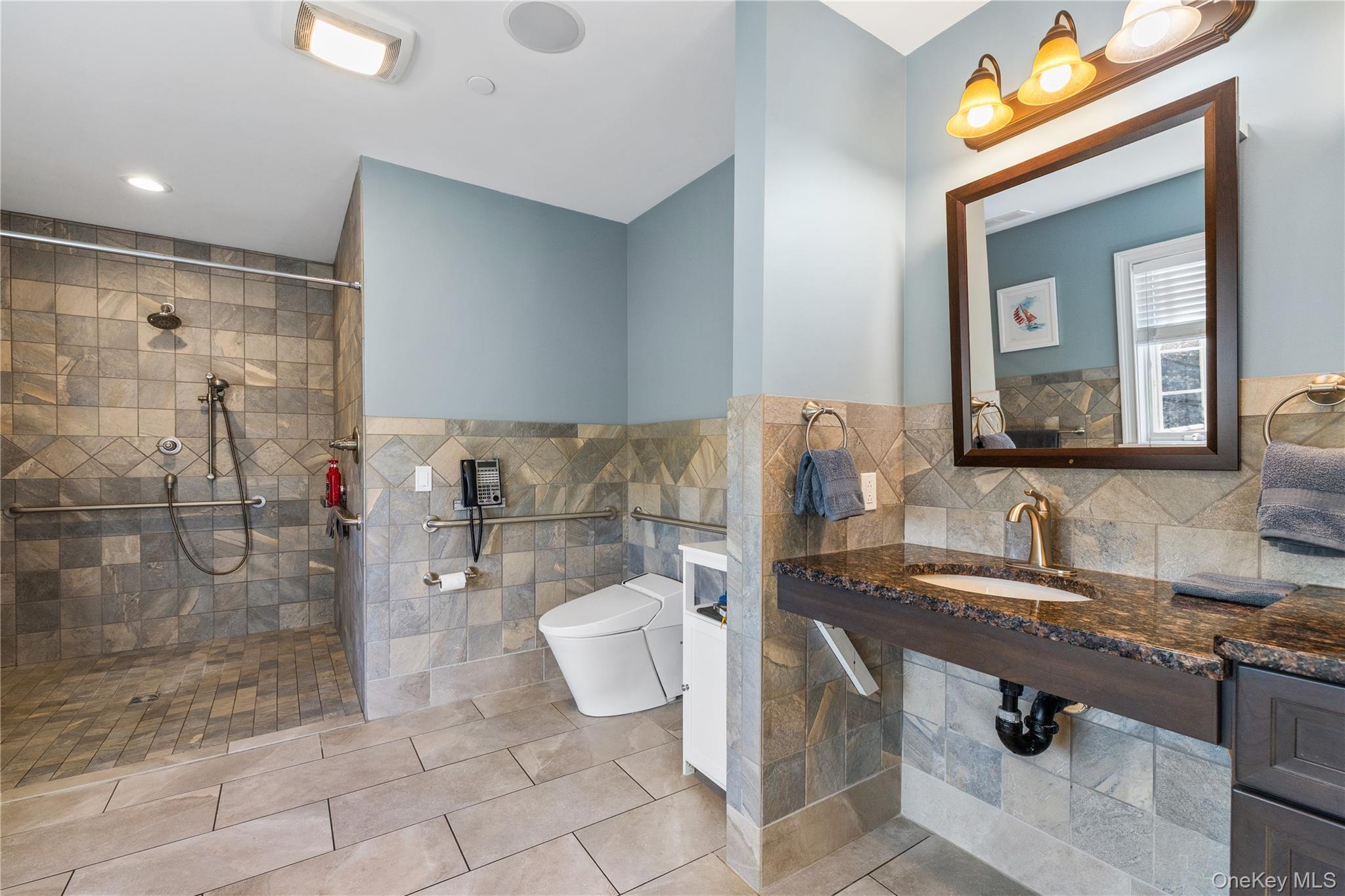 80 Rudd Pond Road Millerton, NY 12546 - Photo 21 of 22 a bathroom with a granite countertop sink a toilet and shower
