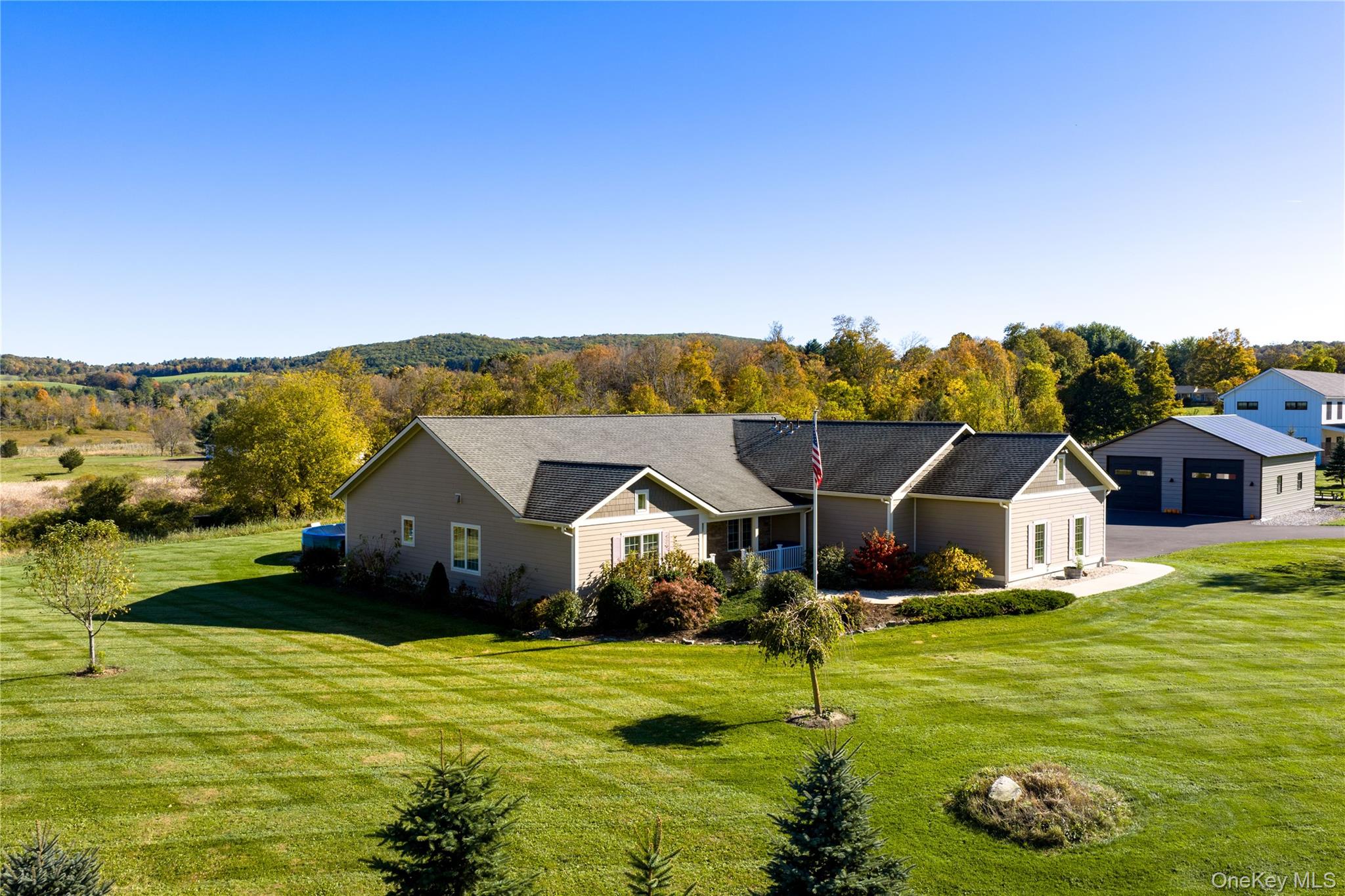 80 Rudd Pond Road Millerton, NY 12546 - Photo 5 of 22 an aerial view of a house with swimming pool and mountains