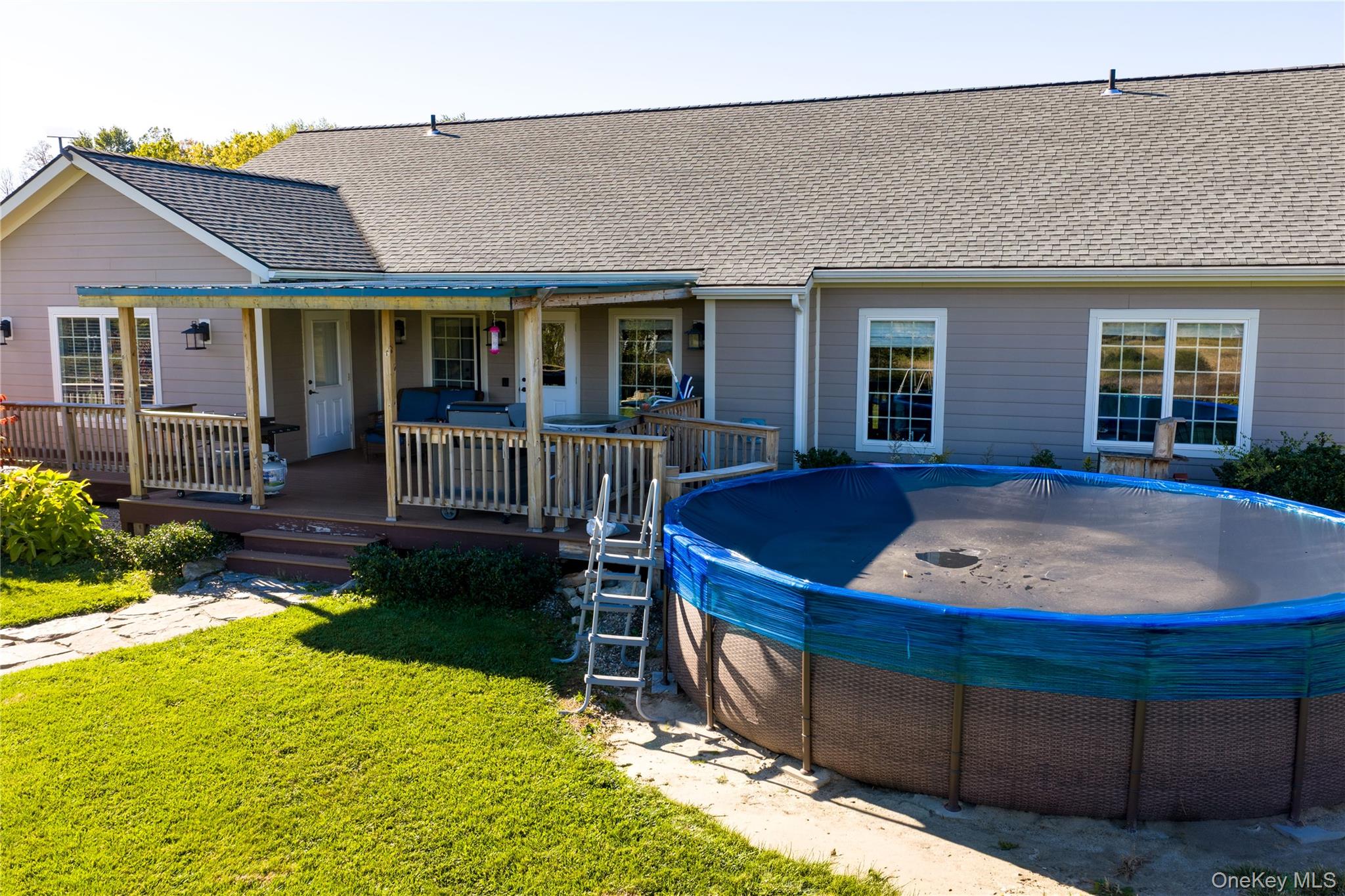 80 Rudd Pond Road Millerton, NY 12546 - Photo 7 of 22 a view of a house with backyard porch and sitting area