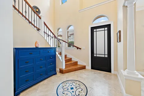 a view of entryway and hall with wooden floor