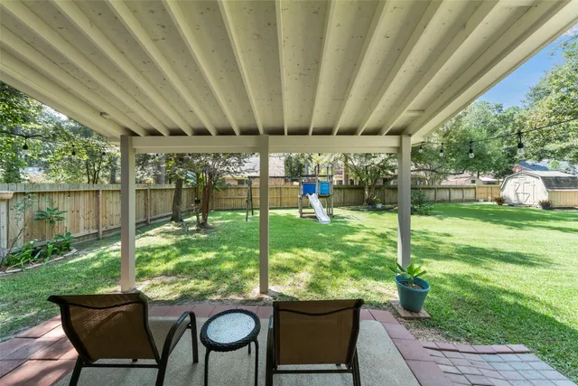 a outdoor dining space with furniture and garden