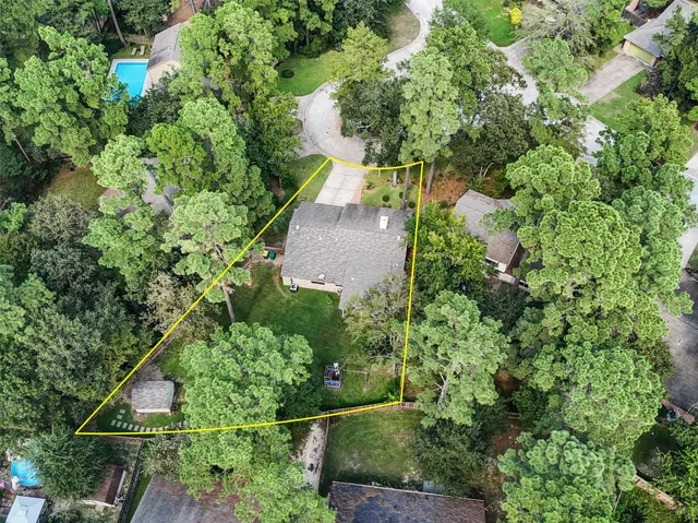 an aerial view of house with yard