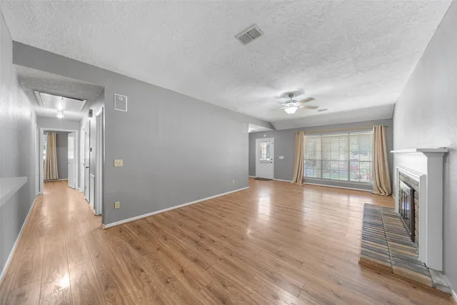 a view of a livingroom with wooden floor