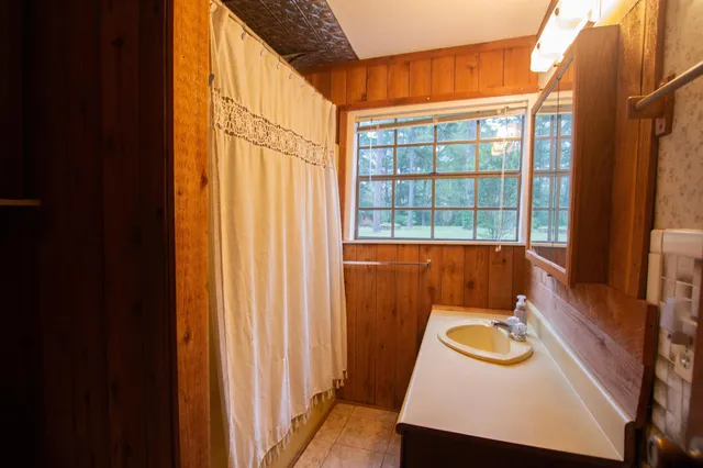 a livingroom with workspace and a window