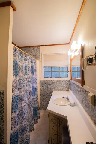 a view of a livingroom with furniture window and wooden floor