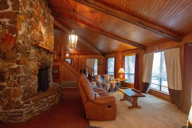 a room with gym equipment and floor to ceiling window