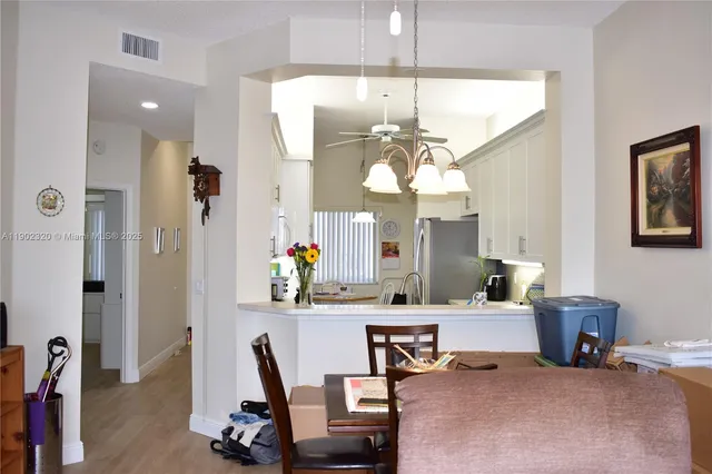 a view of a livingroom with furniture and a chandelier