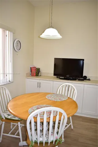 a bedroom with a bed and flat screen tv