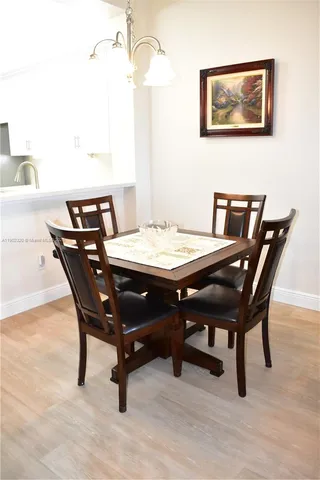 a living room with furniture large window and flat screen tv