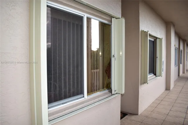 a view of a bathroom from a door