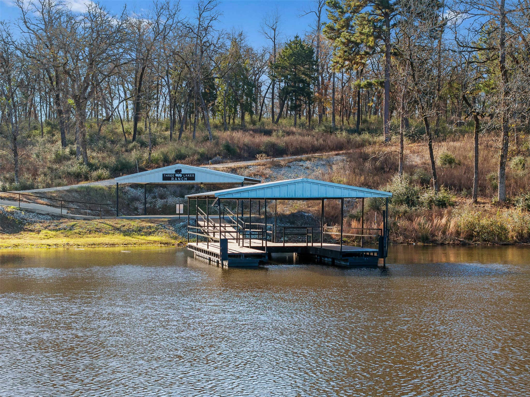 1315 Centerville Tx 75833 Centerville, TX 75833 - Photo 9 of 40 a view of swimming pool with lawn chairs and large trees