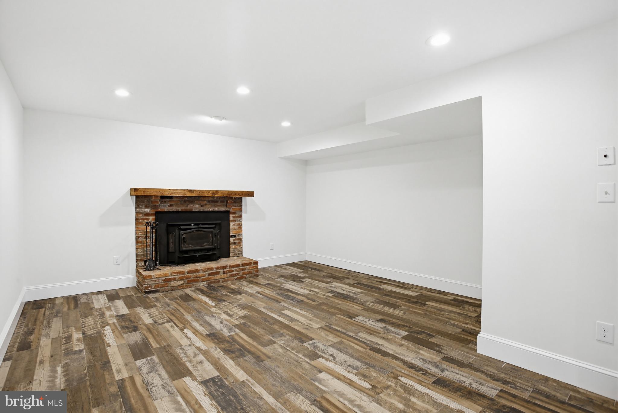 15005 Bushy Park Road Woodbine, MD 21797 - Photo 43 of 75 LOWER LEVEL FAMILY ROOM WITH FIREPLACE