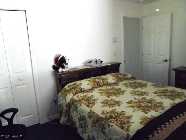 15660 Cemetery Road Fort Myers, FL 33905 - Photo 12 of 15 a bed sitting in a bedroom next to a window
