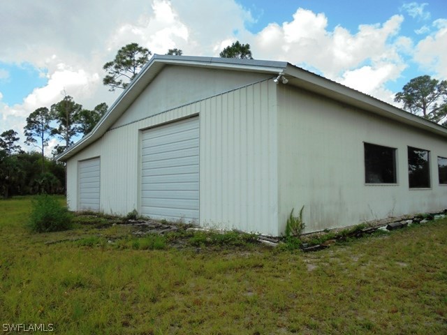 15660 Cemetery Road Fort Myers, FL 33905 - Photo 5 of 15 a house with garden