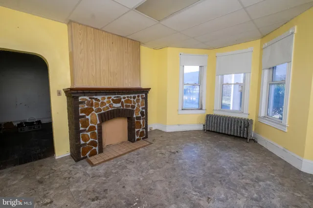 a bathroom with a sink toilet and mirror