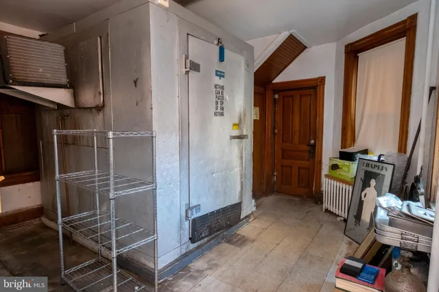 a room with walk in closet and a window