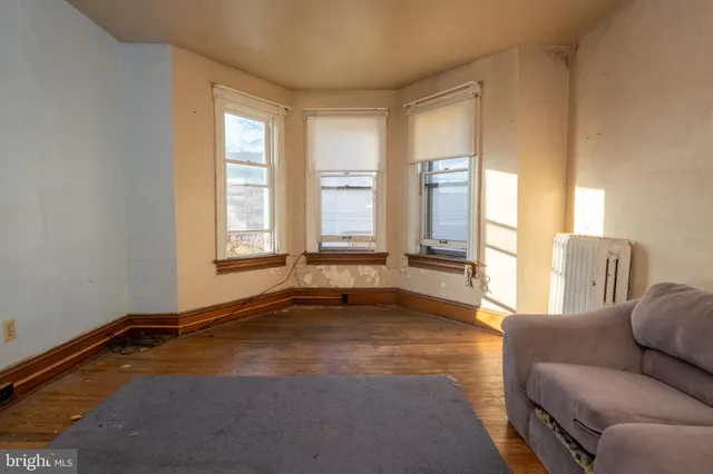 a view of room with window and furniture