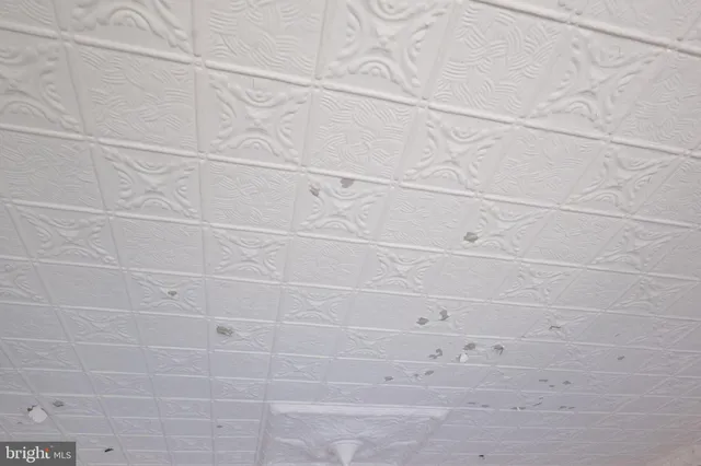 a bathroom with a sink a toilet and shower curtain