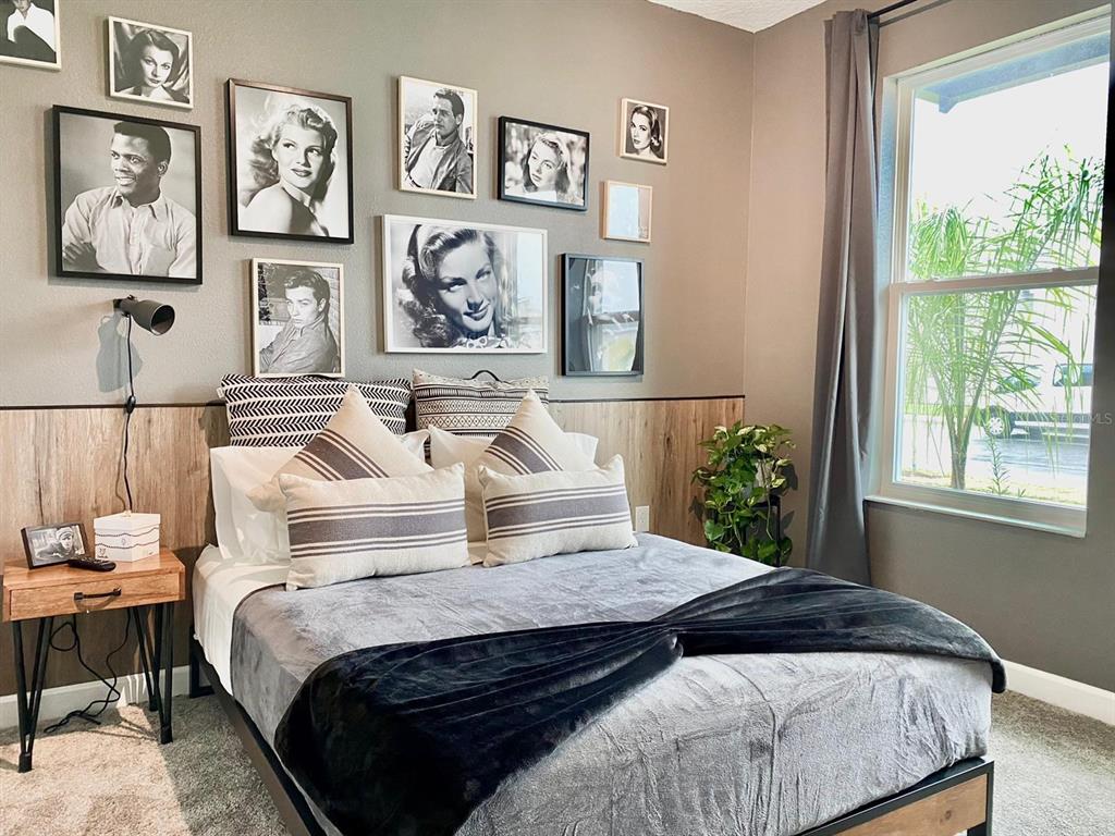 8983 Backswing Way Davenport, FL 33896 - Photo 11 of 30 a bedroom with bed and window