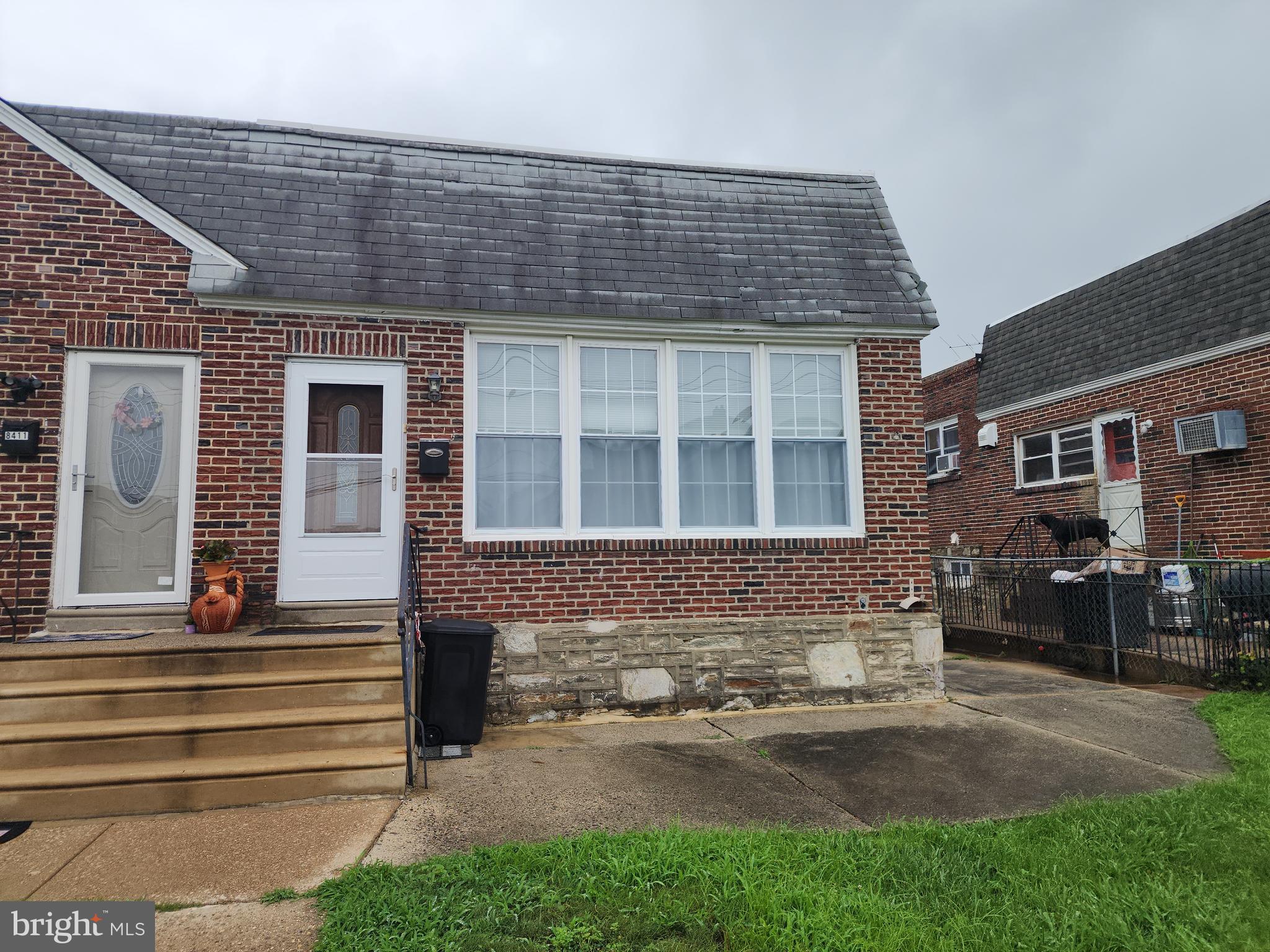 8409 Loretto Avenue Philadelphia, PA 19152 - Photo 2 of 22 a front view of a house with a yard