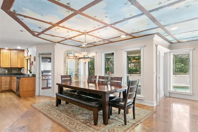 a view of a dining room with furniture window and outside view