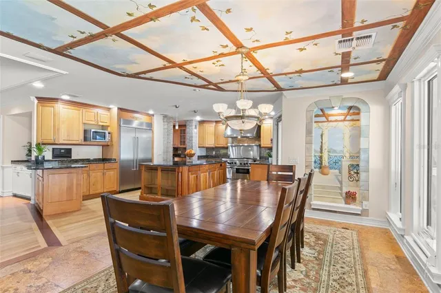 a kitchen with stainless steel appliances granite countertop a sink and cabinets