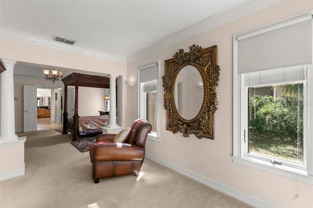 a bathroom with a granite countertop double vanity sink a mirror and a toilet