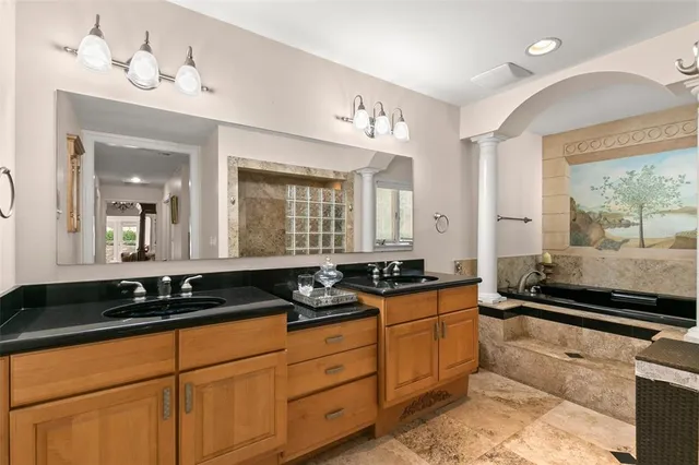 a bathroom with a sink and a large mirror