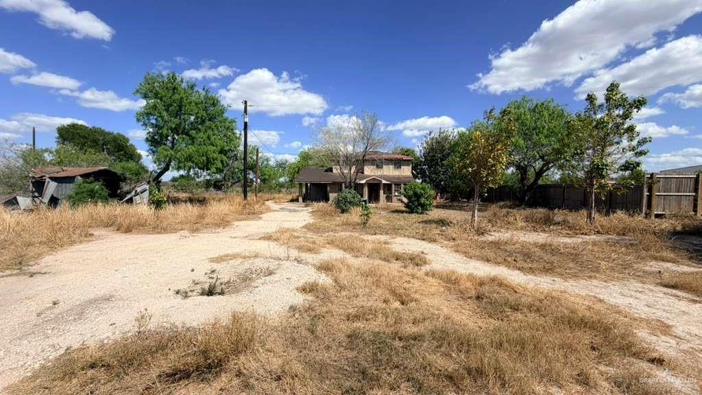 1524 West Hi Line Road Pharr, TX 78577 - Photo 3 of 34 a view of a yard with a house in the background