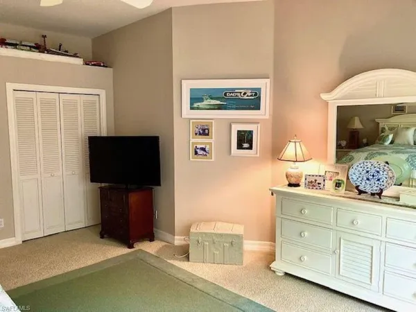 a bedroom with a bed and a cabinets