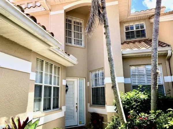 a view of a house with a window and balcony