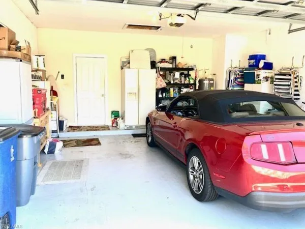 a front view of house with yard and trees
