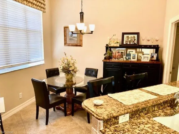 a dining room with a table and chairs