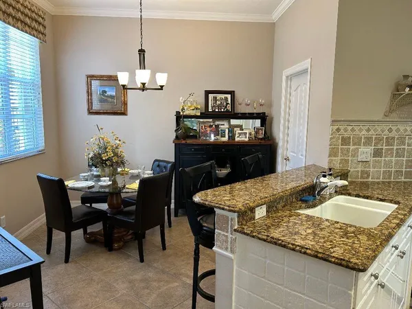 a dining table with chair and window