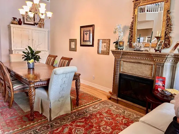a living room with furniture a rug and a fireplace