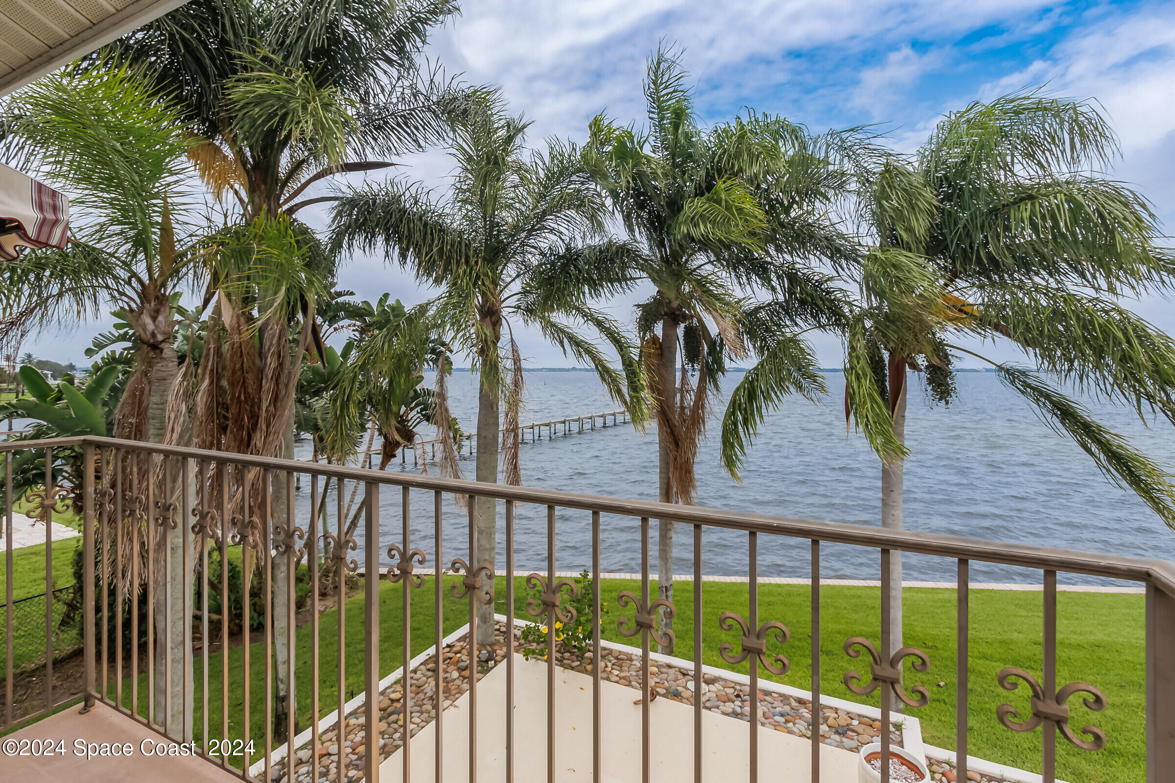 1630 Pine Street Melbourne Beach, FL 32951 - Photo 11 of 54 a view of balcony with wooden floor