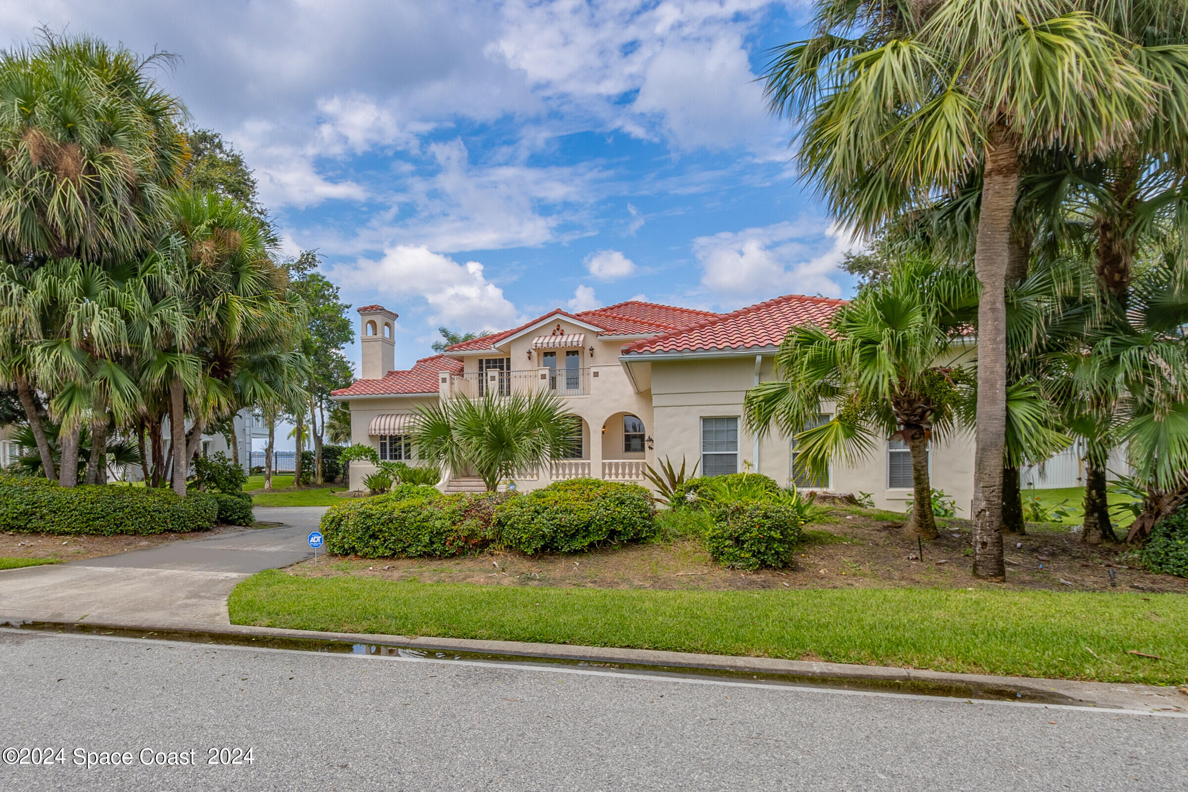 1630 Pine Street Melbourne Beach, FL 32951 - Photo 2 of 54 a front view of house with yard and green space