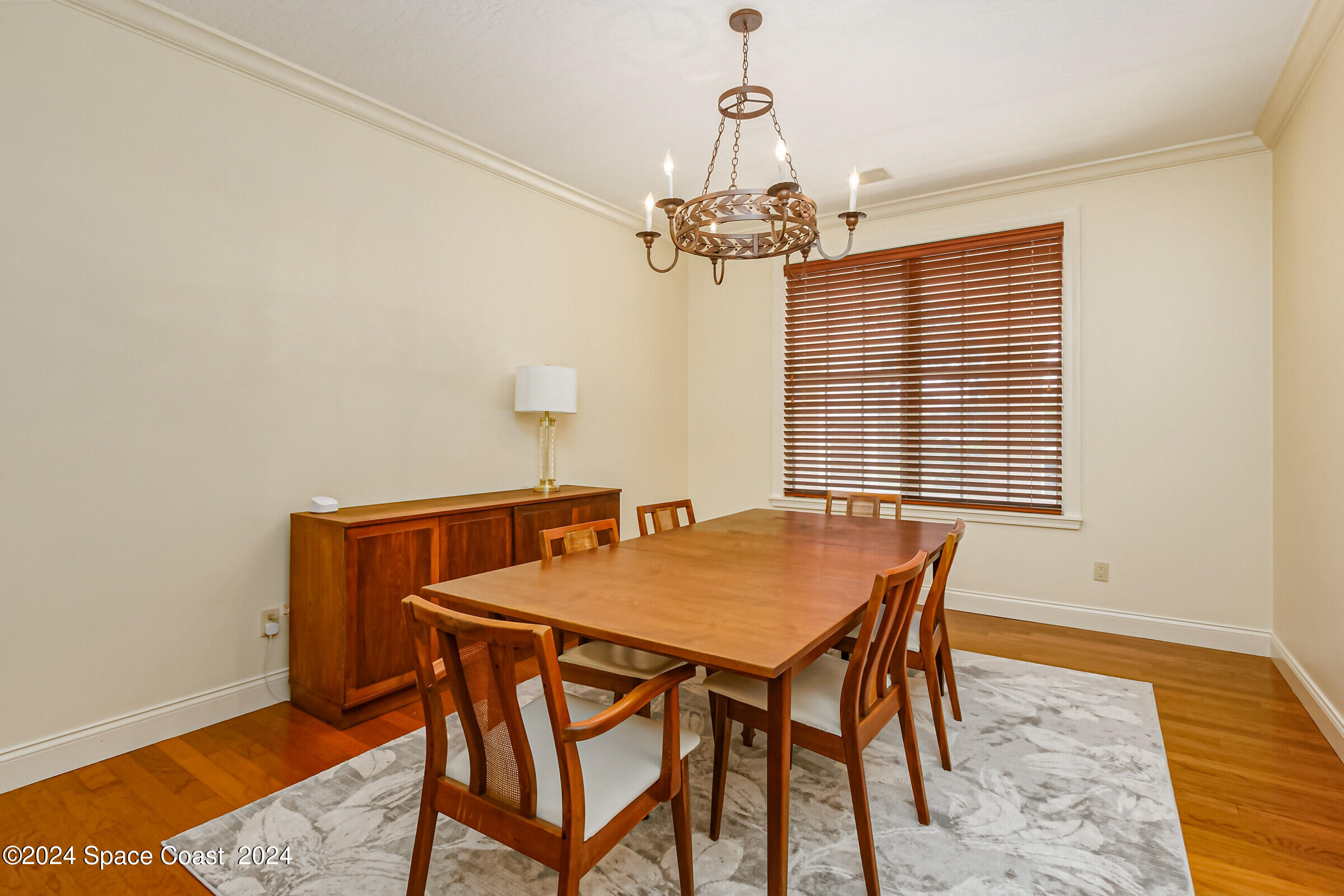 1630 Pine Street Melbourne Beach, FL 32951 - Photo 25 of 54 a view of a dining room with furniture and wooden floor