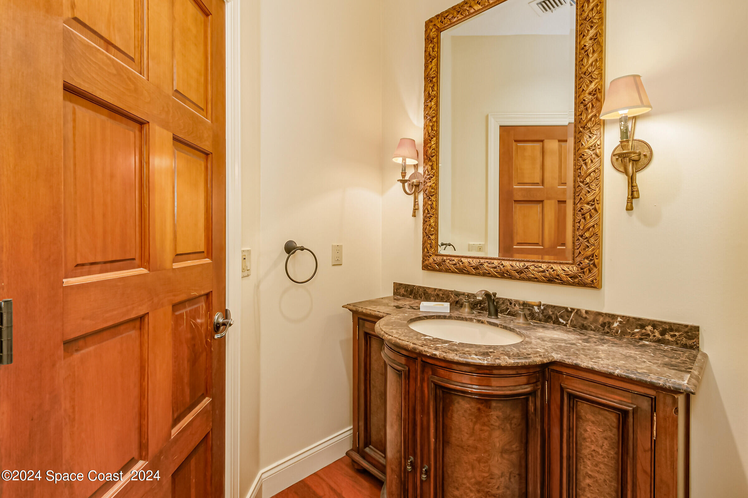 1630 Pine Street Melbourne Beach, FL 32951 - Photo 28 of 54 a bathroom with a granite countertop sink and a mirror