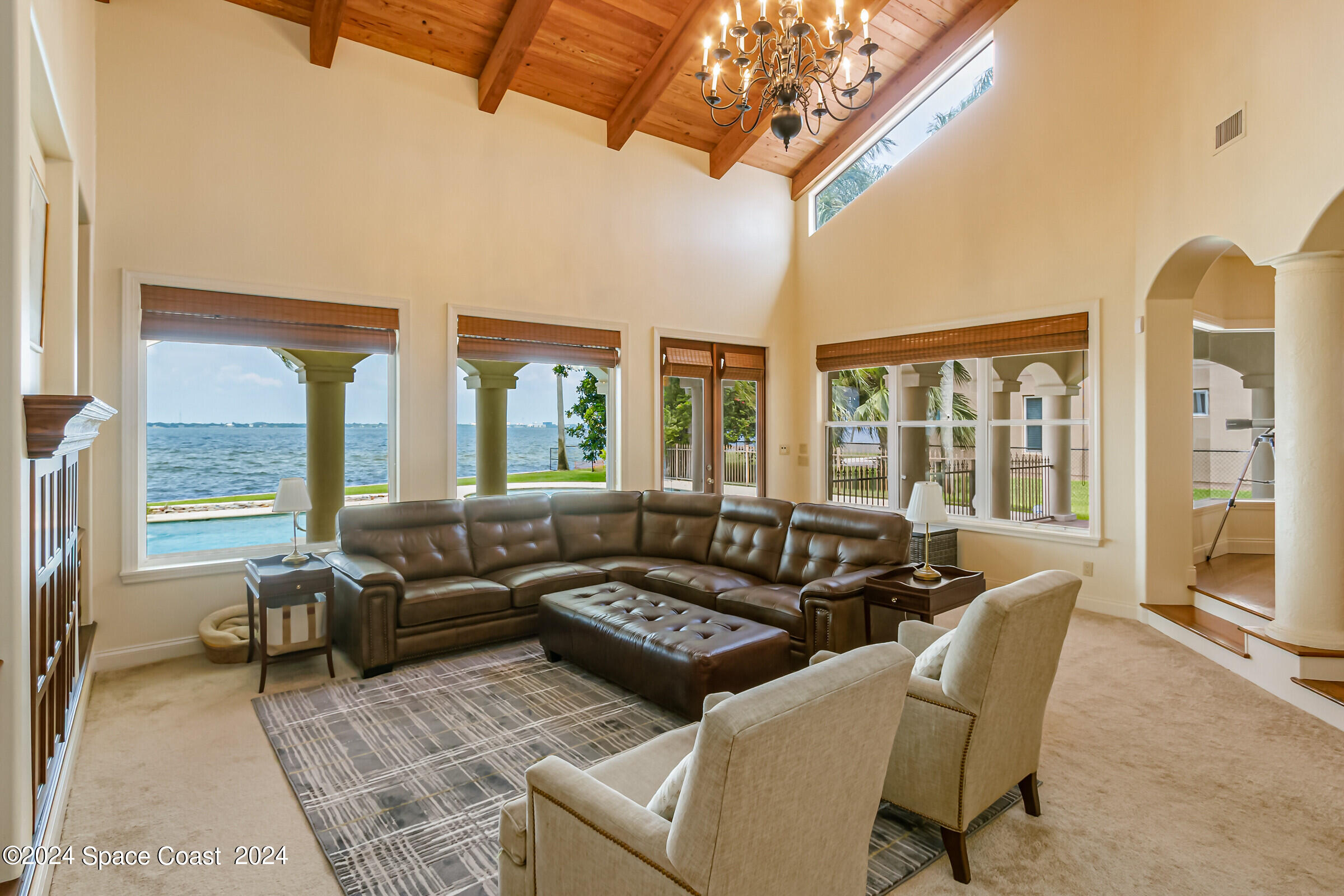 1630 Pine Street Melbourne Beach, FL 32951 - Photo 31 of 54 a living room with furniture and a large window