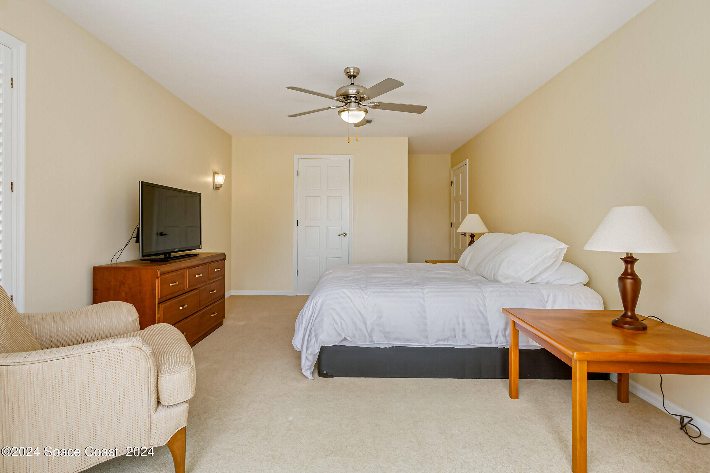 1630 Pine Street Melbourne Beach, FL 32951 - Photo 34 of 54 a bedroom with a bed and a table